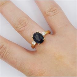 18ct gold three stone oval sapphire and round brilliant cut diamond ring, hallmarked, sapphire approx 2.20 carat, total diamond weight approx 0.25 carat