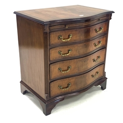 Georgian design mahogany serpentine front chest, cross banded moulded top over brushing slide and four graduated drawers, canted fluted corners, raised on shaped bracket supports 