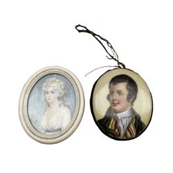 Miniature oval portrait on ivory, half length, of a lady in an ivory frame 5.5cm x 4cm and another miniature portrait