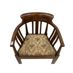 Early 20th century Arts & Crafts period oak elbow chair, shaped bar back and arms on turned and upright supports, upholstered seat, on square tapering supports with squat spade feet