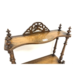 Victorian walnut graduating four tier etagere, each tier serpentine and inlaid with scrolled foliage, twist turned supports, W54cm, H138cm, D32cm
