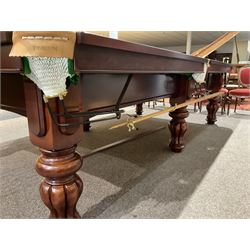 Thurston - 'Standfast' mahogany 10ft snooker table, raised on turned and reeded pilaster supports, together with balls and scoreboard, large rest and cue 