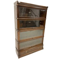 Globe Wernicke - early 20th century oak four sectional stacking library bookcase, each enclosed by glazed up-and-over doors, fitted with single drawer to base
