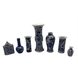 19th century Chinese blue and white Gu form vase, painted with Dragons amongst foliage, H26.5cm, two similar period Chinese blue and white sleeve vases, prunus bottle vase, baluster jar etc