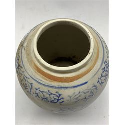 Chinese provincial jar and cover decorated in blue and white with trailing leaves H22cm