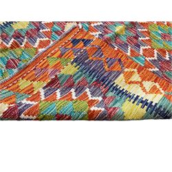 Chobi Kilim amber ground rug, the field decorated with two rows of multi-coloured lozenges, guarded border with repeating geometric design