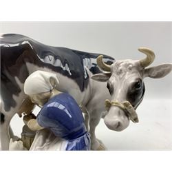 Bing and Grondhal group of a woman milking a cow, modelled by Axel Locher, no.2017, signed H18cm