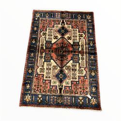 Persian Nahawand ground rug with geometric designs of ivory, blues, greens and reds 200cm x 135cm