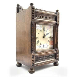  Late Victorian carved oak cased mantel timepiece, silvered dial with Roman numeral chapter ring, eight day single train driven movement, H34cm  