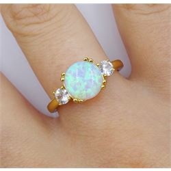 Silver-gilt three stone opal and cubic zirconia ring, stamped 925