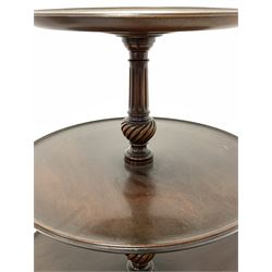 Early 20th century mahogany three tier dumb waiter, raised on spiral turned and fluted column and leaf carved triple splay supports D62cm
