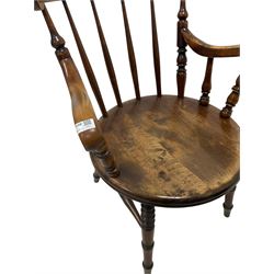 Ibex - early 20th century beech armchair, the shaped cresting rail over spindle back over circular seat raised on turned supports 