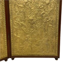Late 19th century Aesthetic Movement screen or room divider, three panels decorated with embossed wallpaper decorated scrolling foliate, putti and fruit in moulded walnut frame, the reverse side decorated in black painted embossed wallpaper with geometric design, double hinged brass hinges, on turned feet