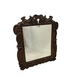 Wall mirror, the rosewood scroll carved frame enclosing mirror 