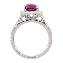 18ct white gold cushion cut pink sapphire and round brilliant cut diamond cluster ring, with diamond set shoulders, hallmarked, sapphire approx 3.10 carat
