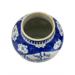 Late 19th century Chinese baluster form jar, painted in underglaze blue with two barbed lobed panels of exotic birds, insects, fruit and foliage, on a prunus and crackled ice ground, Kangxi character marks to base, lacking cover, H24cm