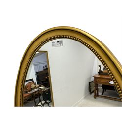 Victorian design gilt framed wall hanging mirror, moulded oval frame with beaded slip, plain mirror plate 
Provenance: From the Estate of the late Dowager Lady St Oswald