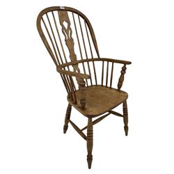 Windsor chair, the splat and spindle back over saddle seat, raised on turned supports 