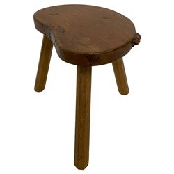 Beaverman - oak stool, kidney shaped top with burr carved with beaver signature, on tapered octagonal splay supports, Colin Almack, Sutton-under-Whitestone Cliffe, Thirsk