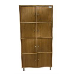 Contemporary oak wavy door cupboard, fitted with eight cupboards with convex and concave shaped facias
