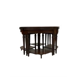 Nest of five mahogany tables, the inset and tooled top over reeded edge, raised on turned and reeded supports 