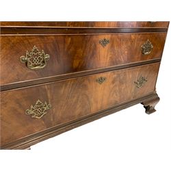 Waring and Gillows - mid-20th century mahogany Georgian style chest on chest,  projecting cornice over plain frieze, canted form with fluted upright corners, three small drawers over six long drawers, lower mould on ogee bracket feet, metal label to drawer