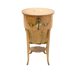 Edwardian satinwood Sheraton revival work table, hand painted with floral and husk garlands and oval portraits, oval form with hinged top and upholstered bag beneath, square tapering out splayed supports connected by shaped undertier, 39cm x 30cm, H72cm (a/f - front split)