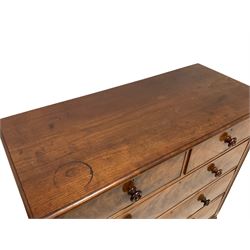 Victorian mahogany straight-front chest, fitted with two short and three long drawers, each with cockbeaded fronts and turned mahogany handles, flanked by reeded uprights, raised on lobe carved turned feet 