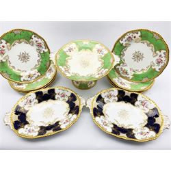 Late Victorian Coalport dessert service decorated with floral sprays within a green and gilt border comprising tall comport and eight plates and a pair of Coalport oval dishes