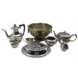 Silver-plated footed punch bowl with twin lion mask and ring handles, Walker & Hall entree dish with beaded borders, three piece silver-plated tea set and other plate