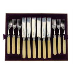 Set of twelve Edwardian silver bladed fish knives and forks with ivorine handles in oak case Sheffield 1906 Maker James Dixon & Sons Ltd 