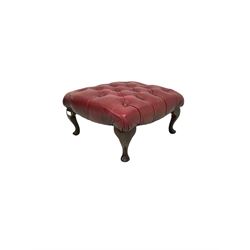 Red leather footstool, upholstered in red leather raised on cabriole supports 