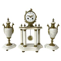 French - Early 20th century white marble and gilt-metal striking portico mantel clock and garniture, circa 1910, with four free-standing columns above a shaped plinth raised on four feet, gilt metal drum case surmounted by two small nesting birds, convex enamel dial with floral garlands and Arabic numerals, gilt Louis XV hands and minute markers, 8-day outside countwheel striking movement striking the hours and half hours on a bell, with a sunburst pendulum and matching pair of garniture urns with conforming decoration.