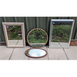 Rectangular framed mirror the border decoration in the form of berries and leaves, gold painted circular mirror and two further mirrors (4)