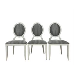 Set six white framed dining chairs, the oval cameo back and seat upholstered in a silver and black snake skin patterned fabric, on tapered supports