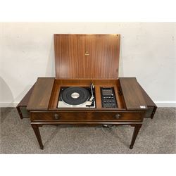 Garrard radiogram in Regency style mahogany table case, the cross banded lift up top revealing Garrard SP25 MKIV turntable and Dynatron system, flanked by integrated fold out speakers, raised on square tapered supports, 97cm x 42cm, H64cm
