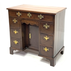 Georgian mahogany knee hole desk, rectangular moulded top, long drawer above frieze drawer, six small drawers and cupboard, on bracket feet, W80cm, H76cm, D47cm