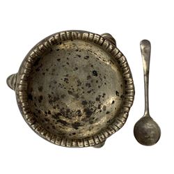 Early 19th century silver cream jug with angular handle H10cm, a George III silver circular salt, both marks rubbed and a silver salt spoon (3) 