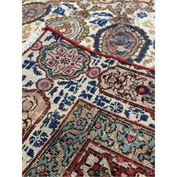 Tabriz cream ground rug, decorated in floral motifs with repeating floral borders 272cm x 170cm