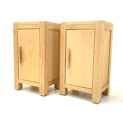 Pair contemporary solid oak lamp cabinets with single door enclosing shelf, raised on stile supports