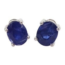Pair of 18ct white gold single stone oval cut sapphire stud earrings, hallmarked