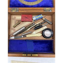 Early 20th century set of drawing instruments including a brass protractor, 19th century ivory parallel rule, Stanley ivory rule and other instruments in a fitted mahogany brass bound case 