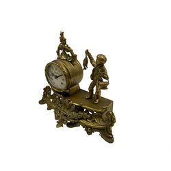20th century cast brass mantle clock with a circular drum movement accompanied by a figure of a young boy with a catch of fish,  eight-day 