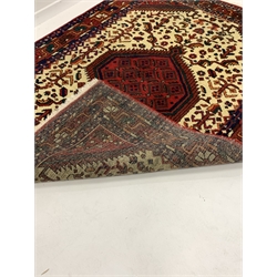  Persian design ground rug, central medallion on cream field with all over geometric decoration, 170cm x 240cm  