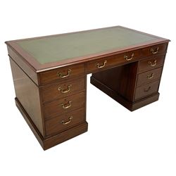 20th century Georgian design mahogany twin pedestal desk, moulded rectangular top with leather inset, fitted with seven drawers, on moulded plinth base