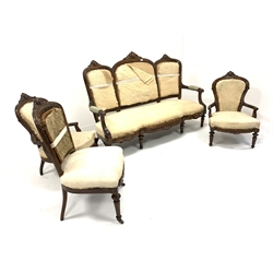 Late Victorian rosewood four piece salon suite, comprising a three seat sofa with acanthus carved crest rail and incised scrolled decoration, open arms, serpentine front, raised on turned fluted and tapered supports, in deconstructed upholstery (W174cm) an open armchair (W58cm) and a side chair (W51cm) together with another matched open armchair (W59cm)