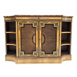 20th century Regency design satinwood side cabinet, the top with rosewood bands and ebonised string inlay over frieze with hand painted design, two geometric panelled cupboards with bergere fronts enclosing one shelf, flanked by four shelves to the canted fluted corners, raised on plinth base W124cm, H81cm, D35cm