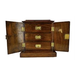 Victorian walnut table-top cabinet, the rectangular stepped top with satinwood and boxwood inlaid decoration, the conforming twin doors opening to reveal three drawers, each with flush brass handles, on plinth base, H32cm, W30.5cm, D21cm