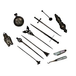 Silver sword pattern letter opener and another letter opener with decorative finial, together with a silver caduceus skewer, three other skewers, silver bear teether (lacks ring) and other silver items 