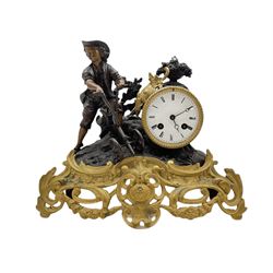 A French 19th century mantle clock depicting a farm boy with a plough at work beside a drum cased clock movement, spelter case with gilding in the rococo style, white enamel dial with roman numerals, minute markers and steel moon hands, with an eight-day countwheel movement striking the hours and half-hours on a bell. No pendulum.


